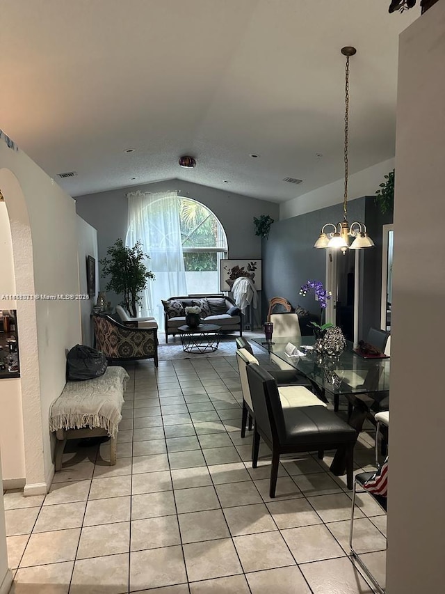 9343 Tango Ter, Boca Raton, FL 33496 - dining room with light tile patterned flooring, lofted ceiling, a chandelier, and arched walkways