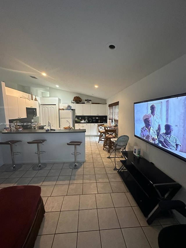 9343 Tango Ter, Boca Raton, FL 33496 - living room with lofted ceiling, light tile patterned floors, and recessed lighting