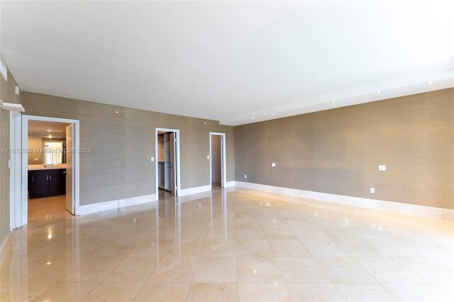 10205 Collins Ave Unit 401, Bal Harbour, FL 33154 - spare room featuring baseboards