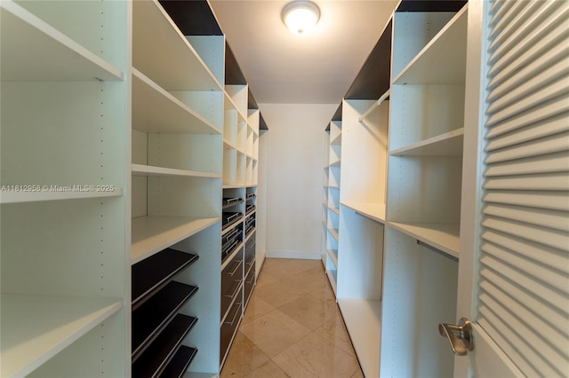 10205 Collins Ave Unit 401, Bal Harbour, FL 33154 - walk in closet with light tile patterned floors