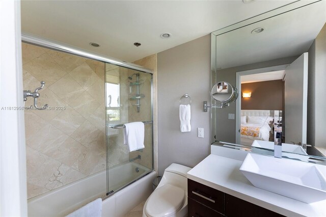 10205 Collins Ave Unit 401, Bal Harbour, FL 33154 - ensuite bathroom featuring shower / bath combination with glass door, vanity, and recessed lighting