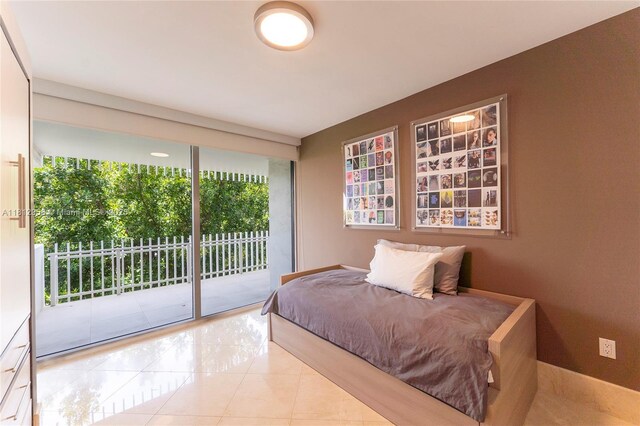10205 Collins Ave Unit 401, Bal Harbour, FL 33154 - bedroom featuring access to outside and tile patterned floors