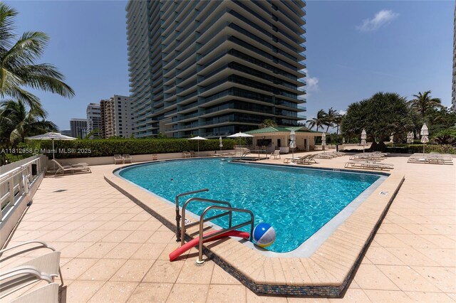 10205 Collins Ave Unit 401, Bal Harbour, FL 33154 - community pool featuring a patio area