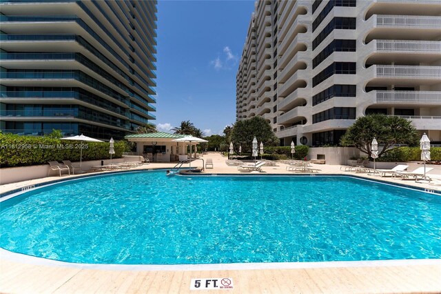 10205 Collins Ave Unit 401, Bal Harbour, FL 33154 - community pool featuring a patio area