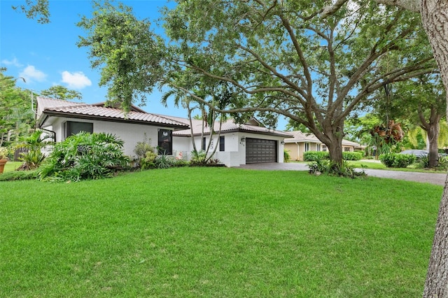 875 NW 108th Ln, Coral Springs, FL 33071 - ranch-style home with a tiled roof, a garage, driveway, and a front yard