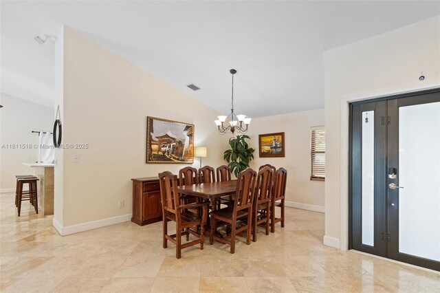 875 NW 108th Ln, Coral Springs, FL 33071 - dining room featuring vaulted ceiling, a chandelier, and baseboards