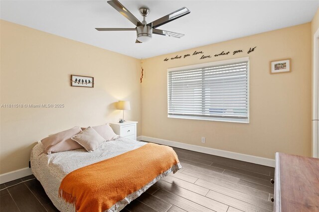 875 NW 108th Ln, Coral Springs, FL 33071 - bedroom with baseboards, wood finish floors, and ceiling fan