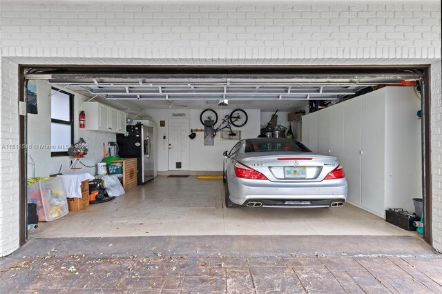 875 NW 108th Ln, Coral Springs, FL 33071 - garage with stainless steel fridge
