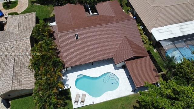 875 NW 108th Ln, Coral Springs, FL 33071 - view of subject property with a pool