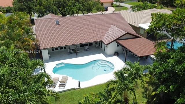 875 NW 108th Ln, Coral Springs, FL 33071 - swimming pool with a patio