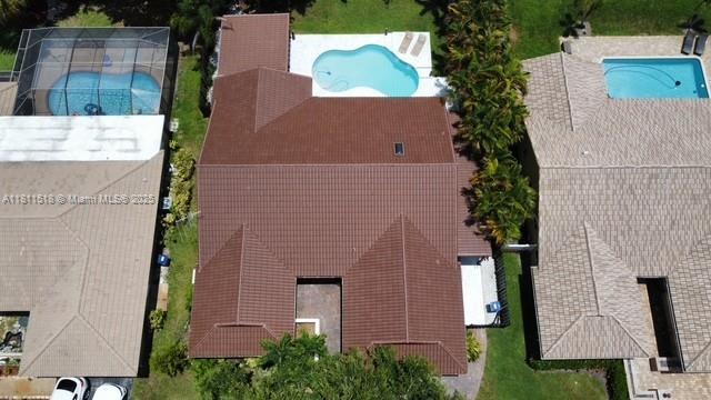 875 NW 108th Ln, Coral Springs, FL 33071 - view of subject property with a pool