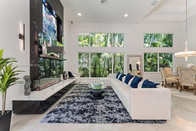 127 Swan Ave, Plantation, FL 33324 - living area with a towering ceiling, healthy amount of natural light, and ornamental molding