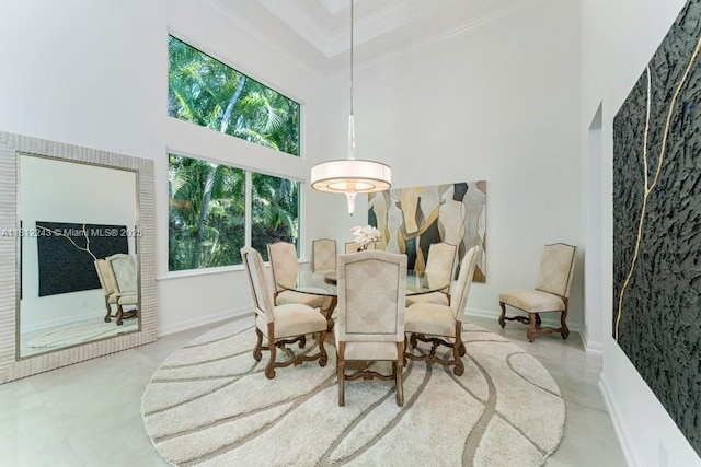 127 Swan Ave, Plantation, FL 33324 - dining area featuring a towering ceiling, ornamental molding, and baseboards