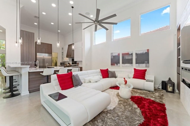 127 Swan Ave, Plantation, FL 33324 - living area with a towering ceiling, healthy amount of natural light, ceiling fan, crown molding, and recessed lighting