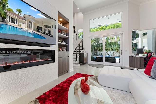 127 Swan Ave, Plantation, FL 33324 - bedroom featuring access to outside, crown molding, a towering ceiling, recessed lighting, and a glass covered fireplace