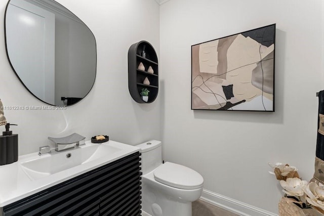 127 Swan Ave, Plantation, FL 33324 - bathroom featuring toilet, vanity, and baseboards