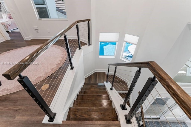 127 Swan Ave, Plantation, FL 33324 - staircase featuring wood finished floors and baseboards