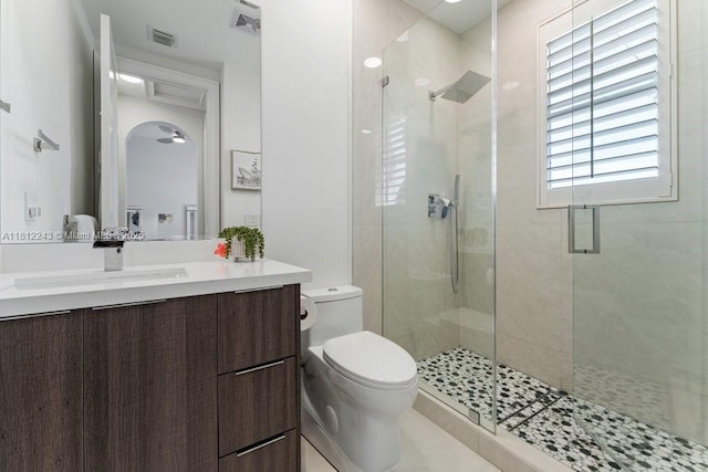 127 Swan Ave, Plantation, FL 33324 - bathroom featuring toilet, a stall shower, and vanity
