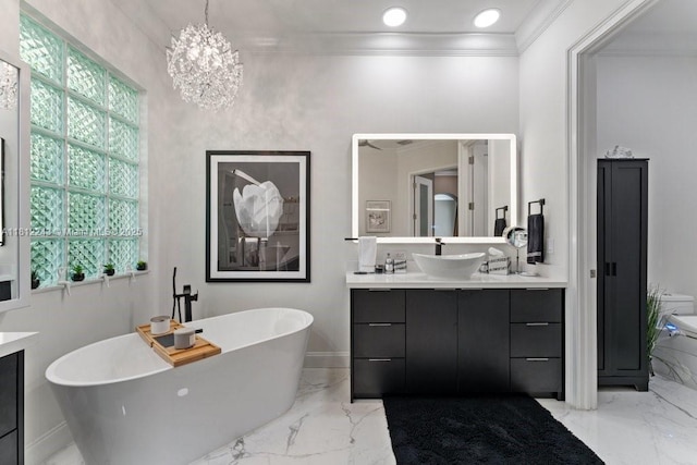127 Swan Ave, Plantation, FL 33324 - full bath with vanity, a freestanding bath, marble tiled floors, ornamental molding, and a chandelier