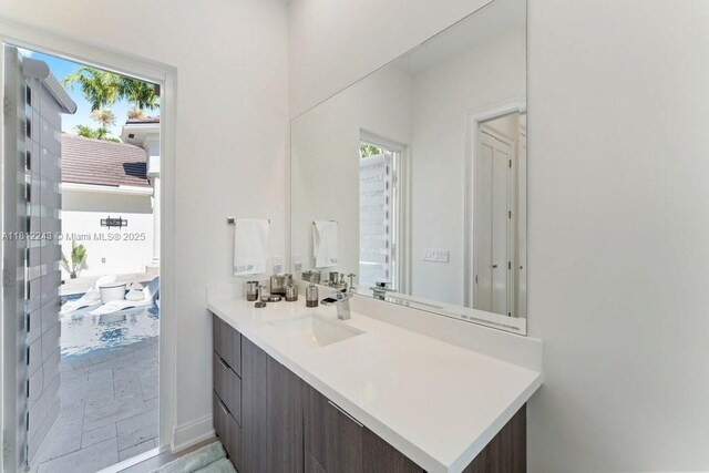 127 Swan Ave, Plantation, FL 33324 - bathroom featuring vanity and healthy amount of natural light