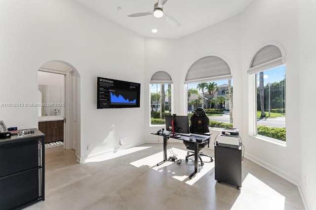 127 Swan Ave, Plantation, FL 33324 - office space with ceiling fan, concrete floors, a high ceiling, baseboards, and arched walkways
