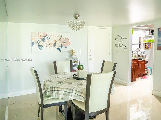 7850 W Mcnab Rd Unit 212, Tamarac, FL 33321 - dining area featuring light tile patterned floors and baseboards