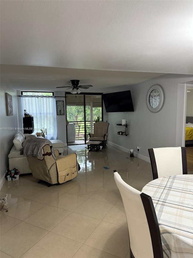 7850 W Mcnab Rd Unit 212, Tamarac, FL 33321 - living room with baseboards, a ceiling fan, and light tile patterned floors