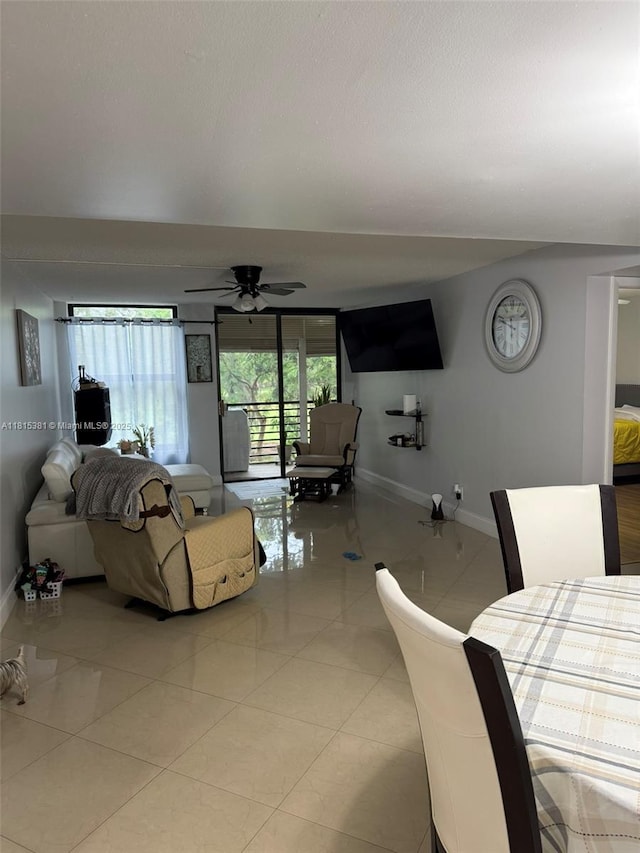 7850 W Mcnab Rd Unit 212, Tamarac, FL 33321 - living area with baseboards, a ceiling fan, and light tile patterned flooring