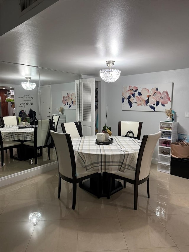 7850 W Mcnab Rd Unit 212, Tamarac, FL 33321 - dining room featuring a chandelier