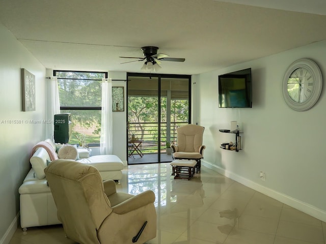 7850 W Mcnab Rd Unit 212, Tamarac, FL 33321 - tiled living room featuring baseboards and ceiling fan