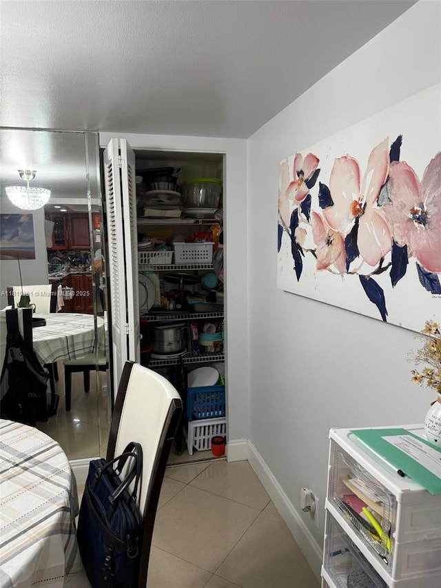7850 W Mcnab Rd Unit 212, Tamarac, FL 33321 - bedroom with tile patterned floors, baseboards, and a closet