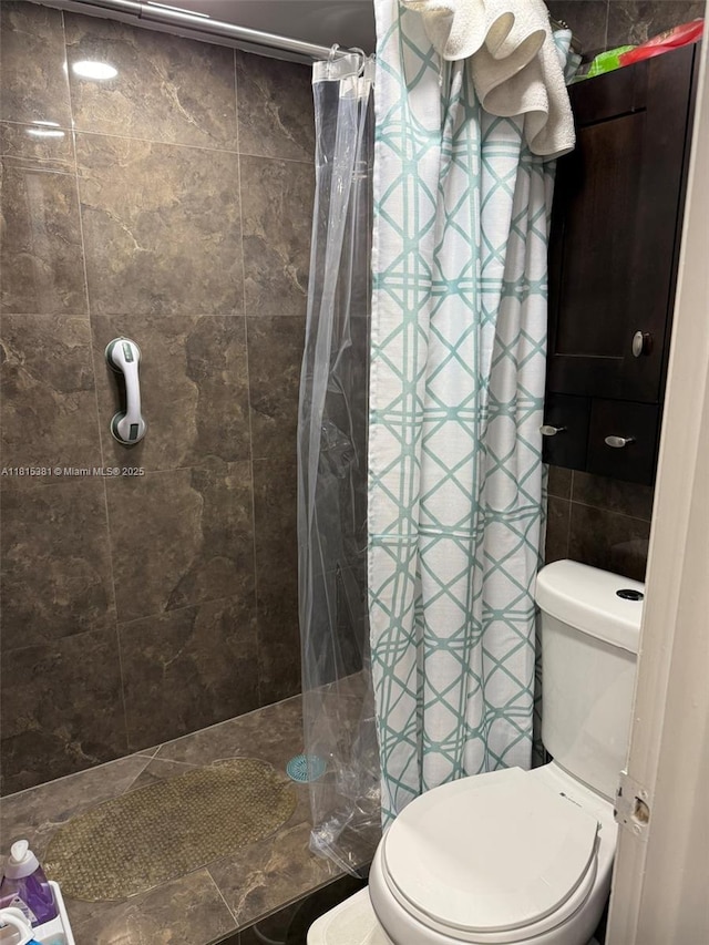7850 W Mcnab Rd Unit 212, Tamarac, FL 33321 - bathroom featuring toilet and a tile shower