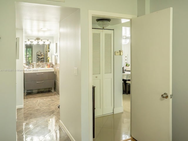 7850 W Mcnab Rd Unit 212, Tamarac, FL 33321 - corridor with light marble finish flooring and baseboards