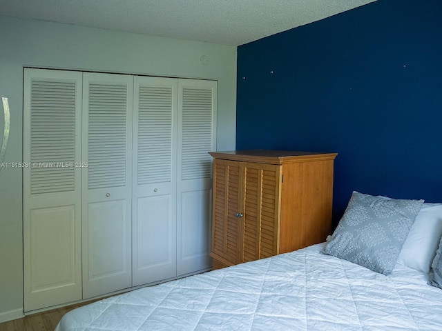 7850 W Mcnab Rd Unit 212, Tamarac, FL 33321 - bedroom featuring a closet and wood finished floors