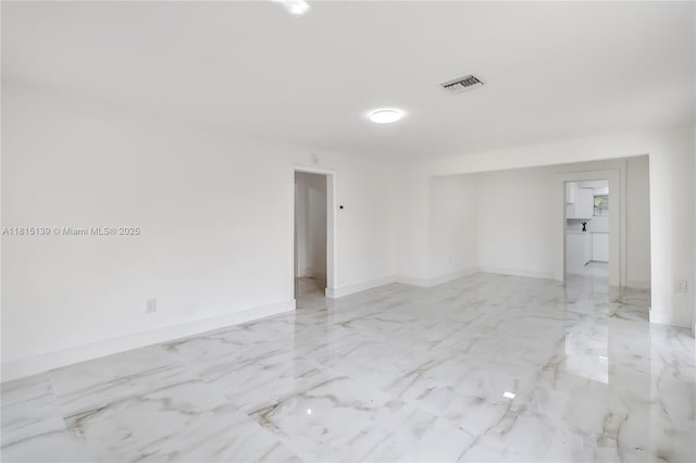 2210 NW 154th St, Miami Gardens, FL 33054 - spare room featuring light marble finish flooring and baseboards