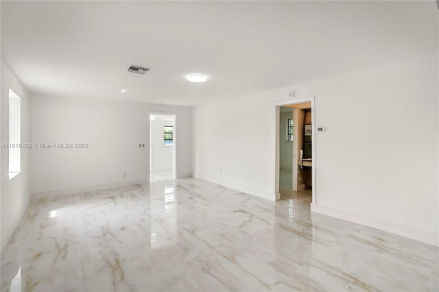 2210 NW 154th St, Miami Gardens, FL 33054 - empty room with light marble finish floors and baseboards