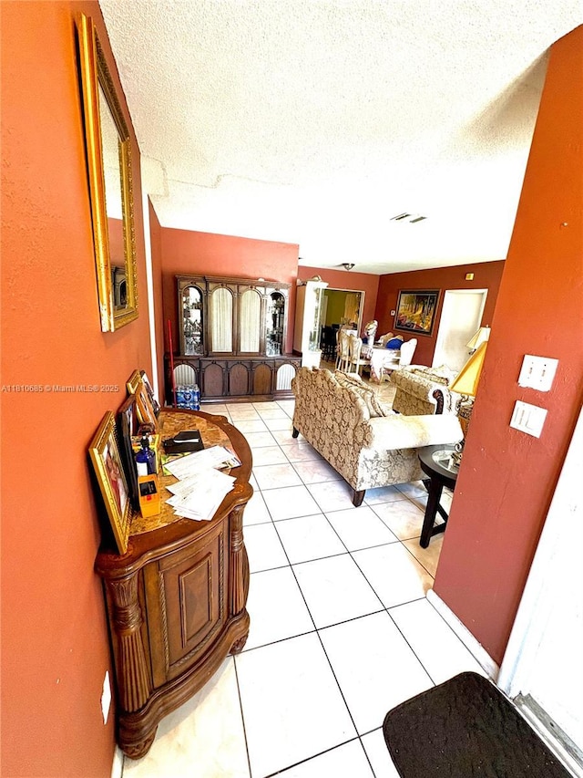 4781 NW 19th Ct, Lauderhill, FL 33313 - tiled living area featuring a textured ceiling