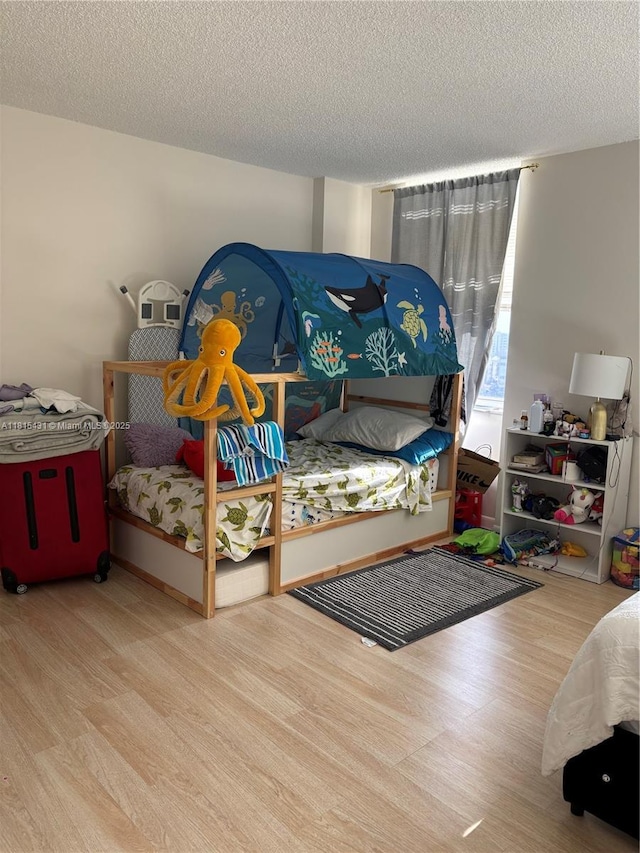 1865 S Ocean Dr Unit 11I, Hallandale Beach, FL 33009 - bedroom featuring wood finished floors and a textured ceiling