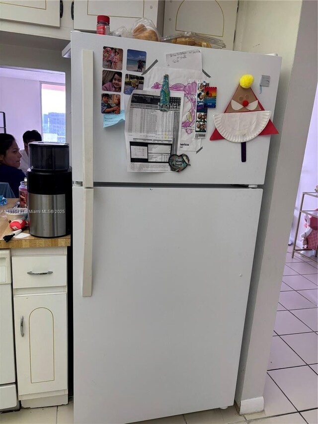1865 S Ocean Dr Unit 11I, Hallandale Beach, FL 33009 - kitchen view of freestanding refrigerator, light countertops, and white cabinets