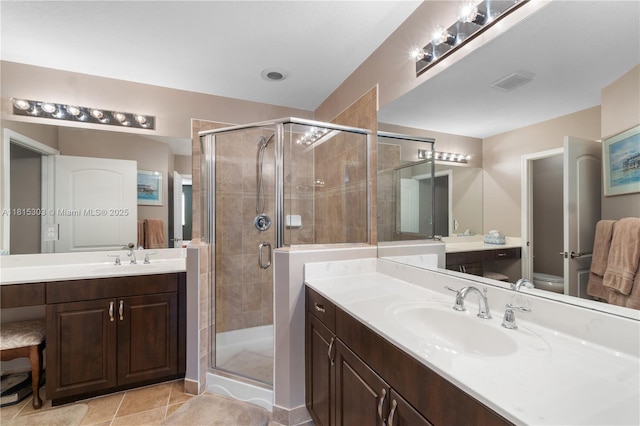 7702 Paddock Pl, Davie, FL 33328 - bathroom featuring a shower stall, two vanities, and tile patterned floors