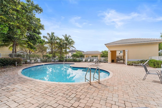 7702 Paddock Pl, Davie, FL 33328 - community pool featuring a patio