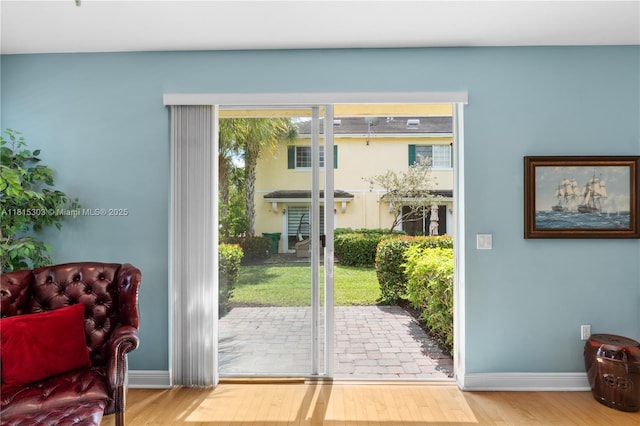 7702 Paddock Pl, Davie, FL 33328 - doorway featuring baseboards and wood finished floors