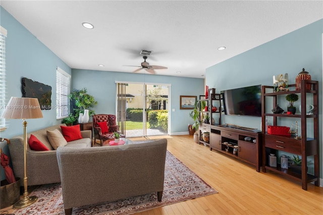 7702 Paddock Pl, Davie, FL 33328 - living area with wood finished floors, healthy amount of natural light, ceiling fan, and recessed lighting