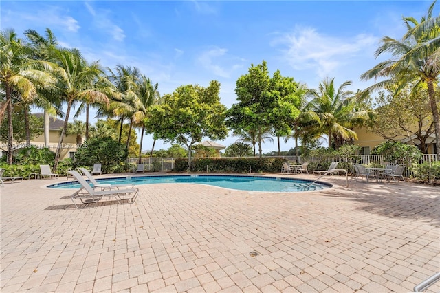 7702 Paddock Pl, Davie, FL 33328 - community pool featuring a patio