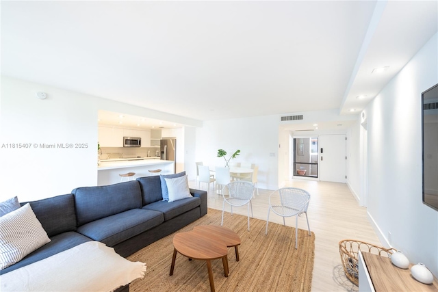 181 Crandon Blvd Unit 306, Key Biscayne, FL 33149 - living area with light wood-type flooring and baseboards