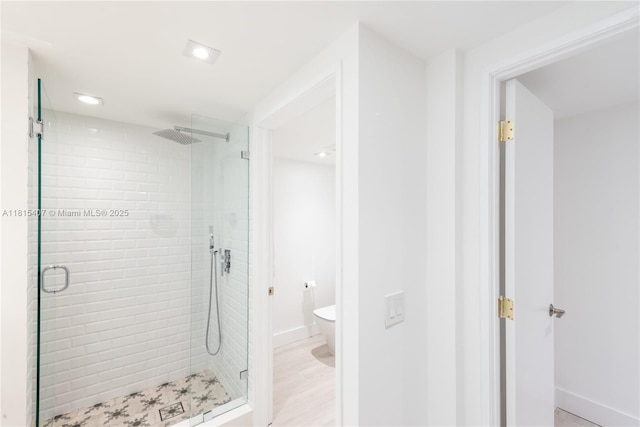181 Crandon Blvd Unit 306, Key Biscayne, FL 33149 - bathroom featuring a stall shower, toilet, baseboards, and recessed lighting