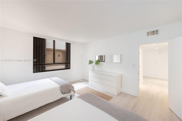 181 Crandon Blvd Unit 306, Key Biscayne, FL 33149 - bedroom featuring light wood finished floors and baseboards