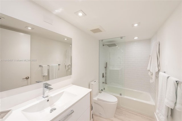 181 Crandon Blvd Unit 306, Key Biscayne, FL 33149 - full bath with toilet, vanity, shower / washtub combination, wood finished floors, and recessed lighting