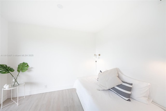 181 Crandon Blvd Unit 306, Key Biscayne, FL 33149 - unfurnished bedroom with wood finished floors and baseboards
