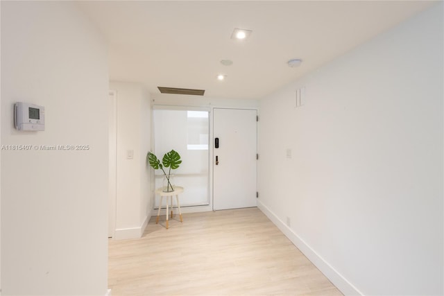 181 Crandon Blvd Unit 306, Key Biscayne, FL 33149 - corridor with light wood-style floors, baseboards, and recessed lighting